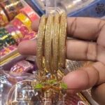 Elegant-Gold-Textured-Bangles-with-Hanging-Jhumkas